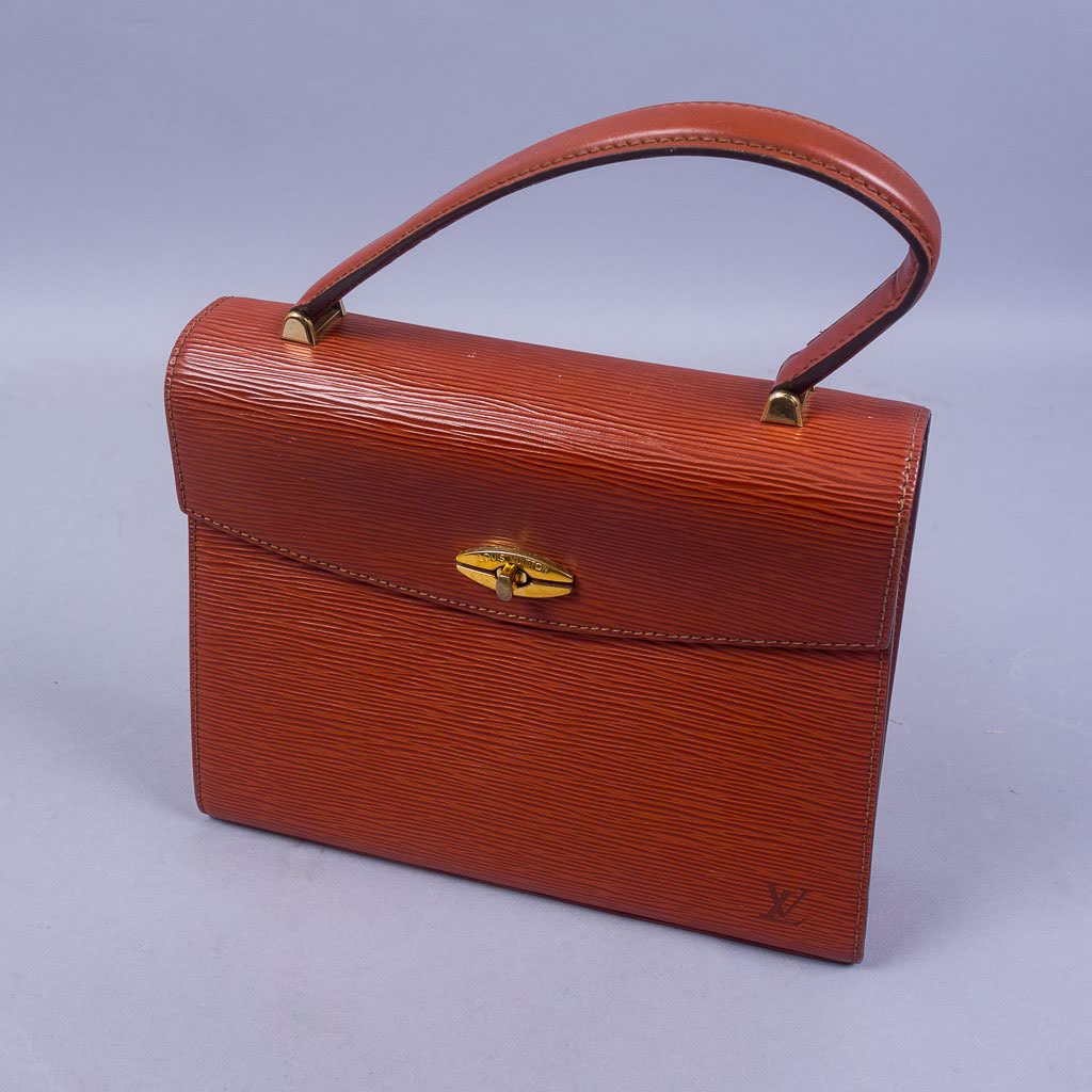Webb's - Originally created in 1860, Louis Vuitton Nomade leather